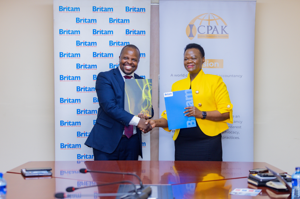 Britam General Insurance CEO and Principal Officer James Mbithi (left) and Institute of Certified Public Accountants of Kenya (ICPAK) CEO and Secretary to the Council CPA Dr. Grace Kamau during the signing of a partnership that will provide ICPAK's over 40,000 members with tailored insurance solutions, including professional indemnity, medical, motor and home insurance, in Nairobi.